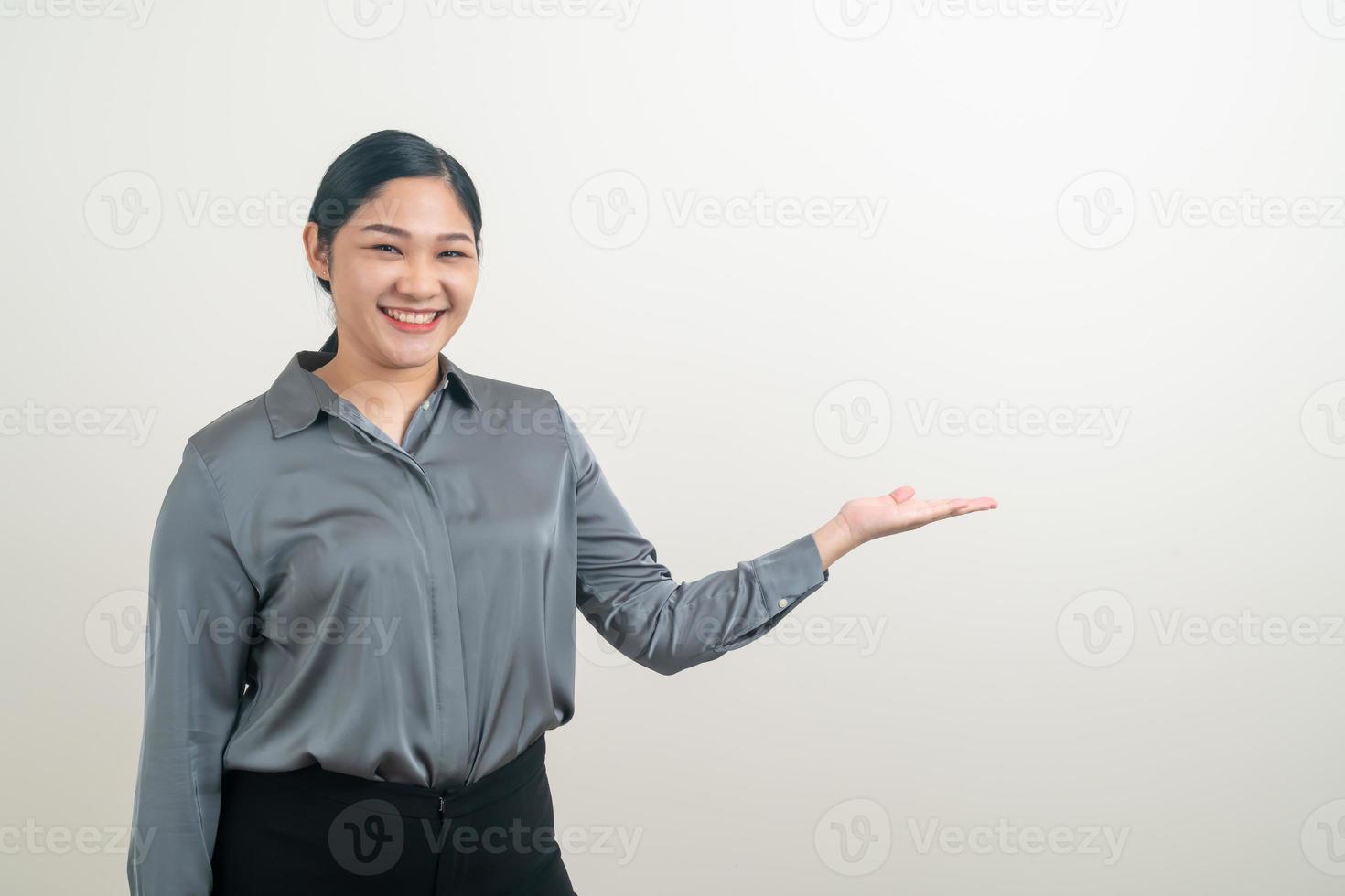 Asian woman with hand presenting on wall photo