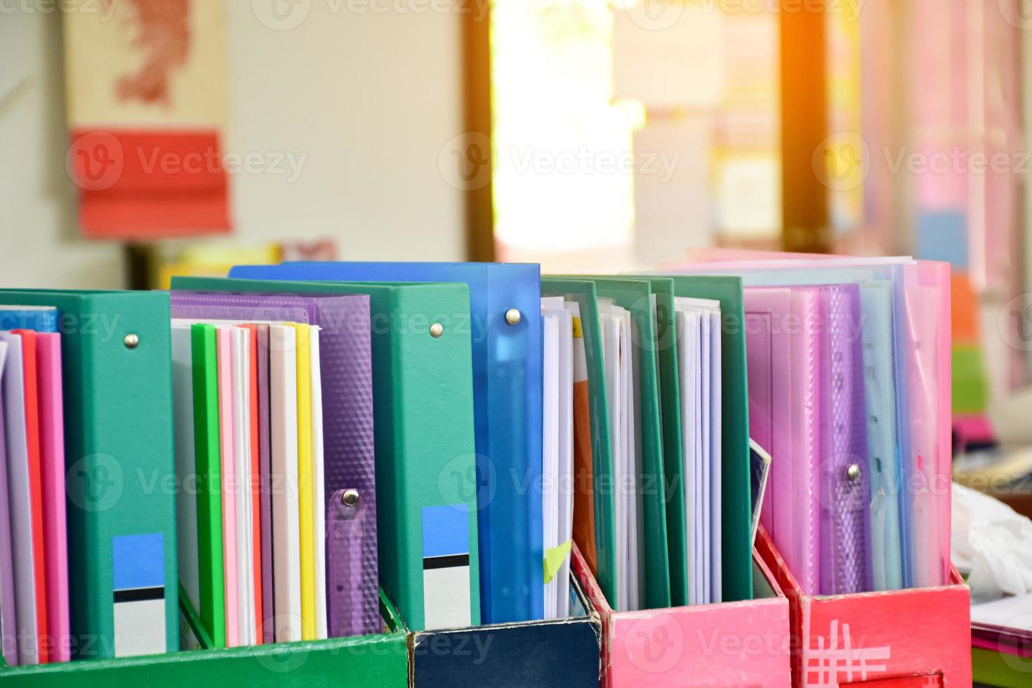 Closeup view of paperwork box for keeping various documents inside which is placed on the table in the office, soft focus. photo