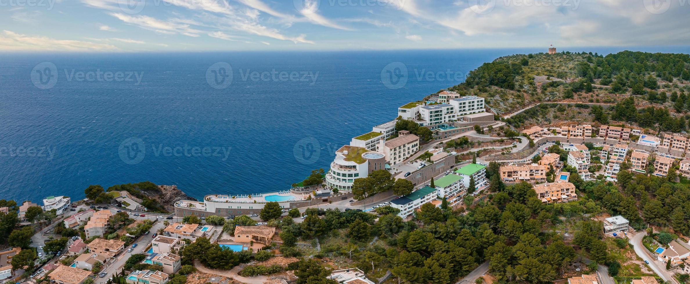 Aerial view of the luxury cliff house hotel on top of the cliff on the island of Mallorca. photo