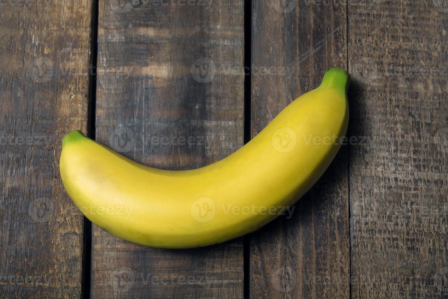 Healthy fruit banana on wood table. photo