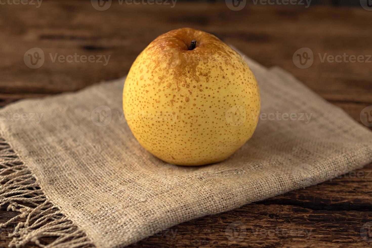 Healthy fruit food Chinese pear on wood table. photo