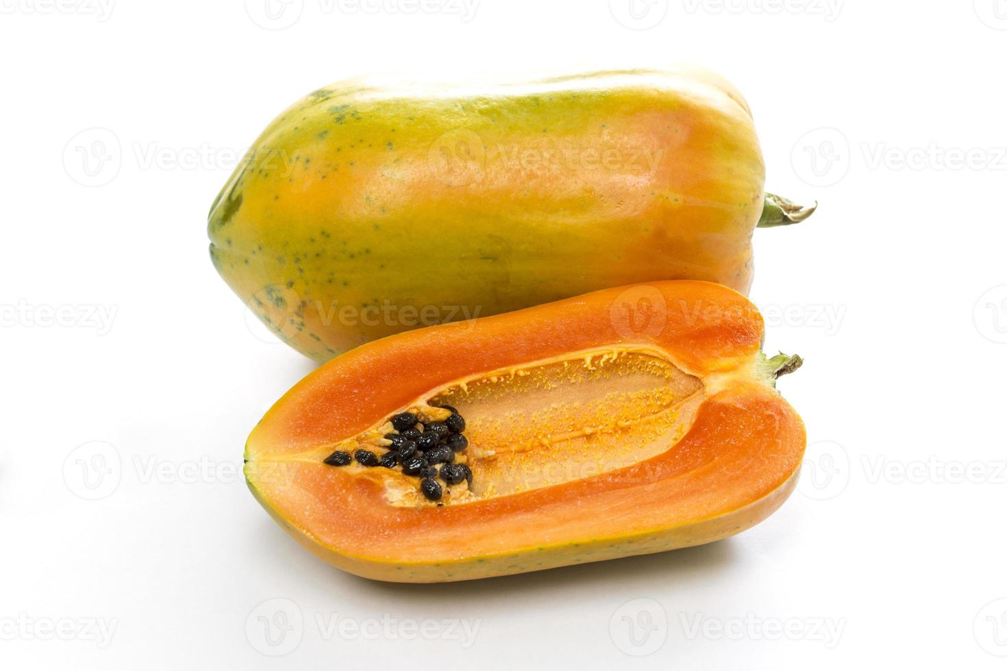 Ripe papaya on white background photo