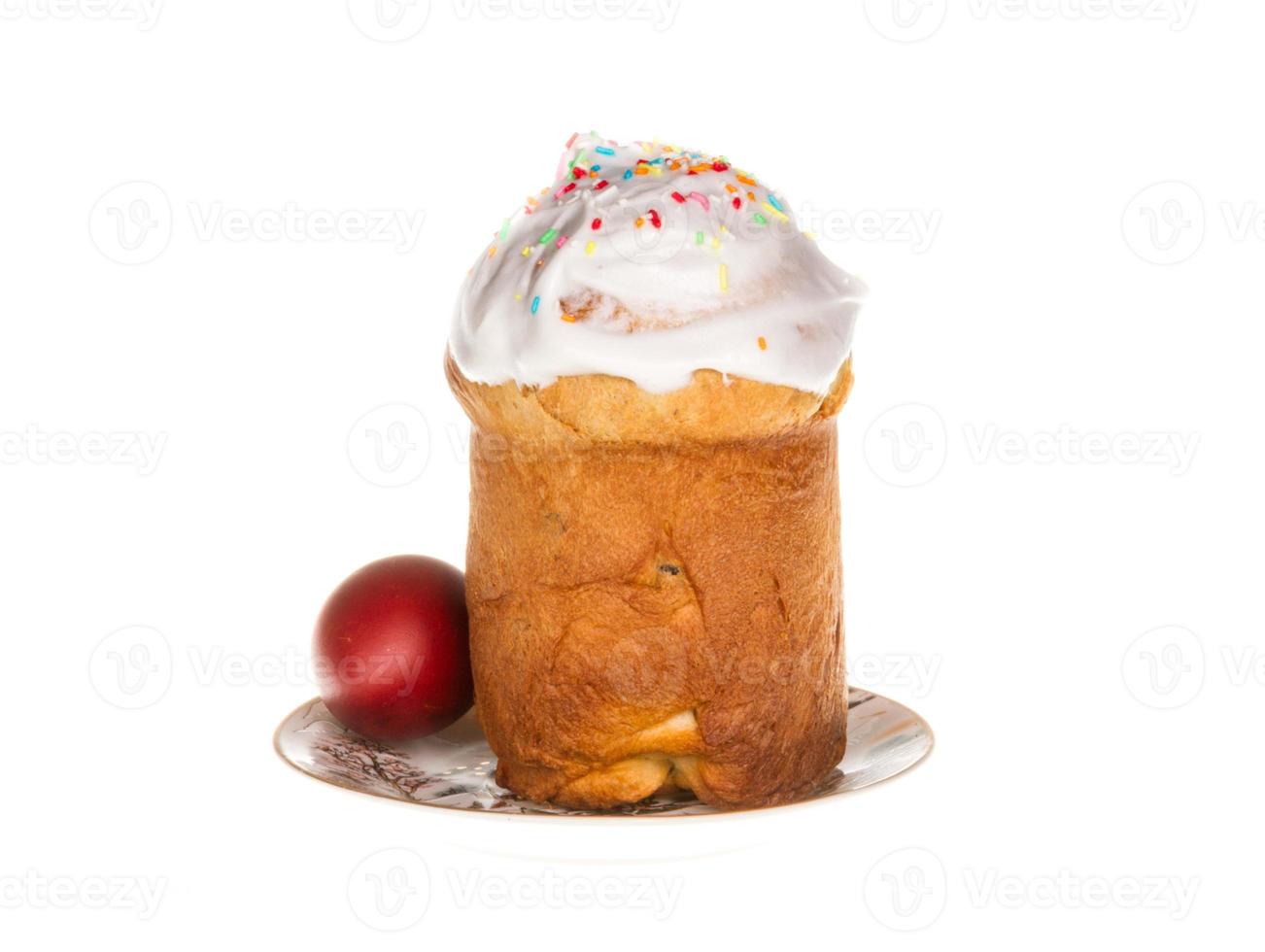 Easter cake with glace icing and easter eggs on white background photo