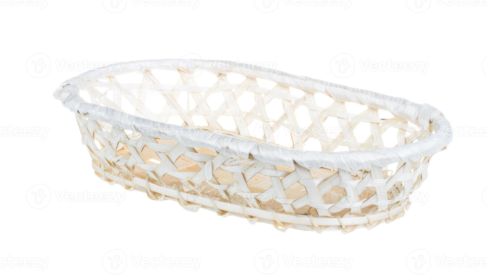 Wickerwork empty yellow breadbasket on white background photo