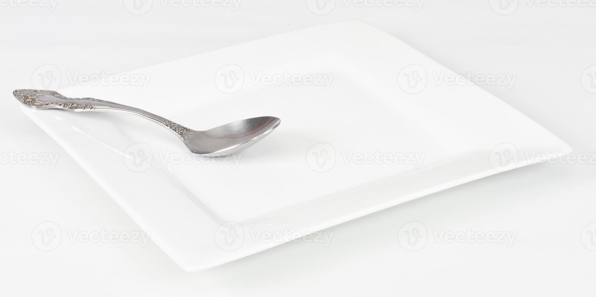spoon and white plate photo