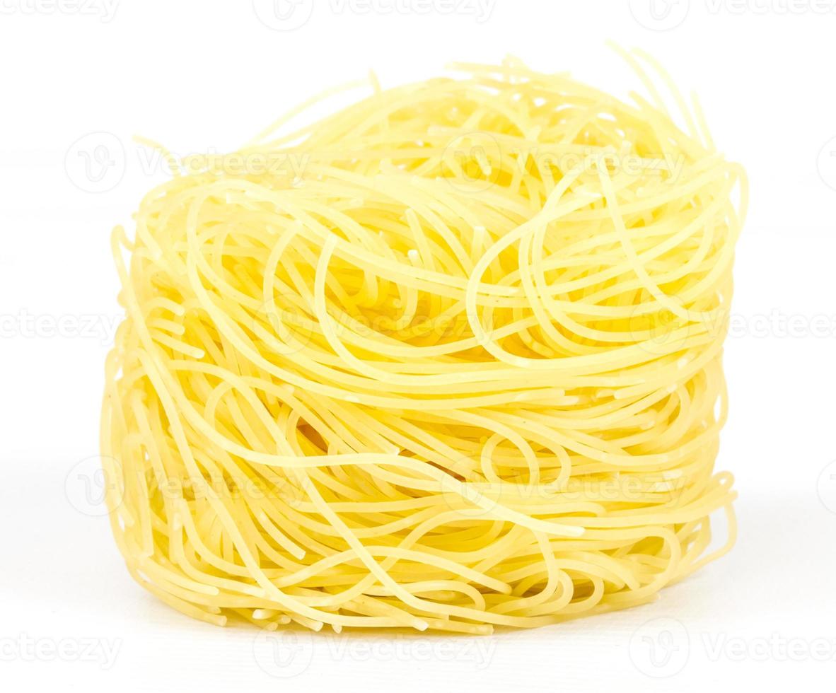 A portion of tagliatelle italian pasta isolated on white photo
