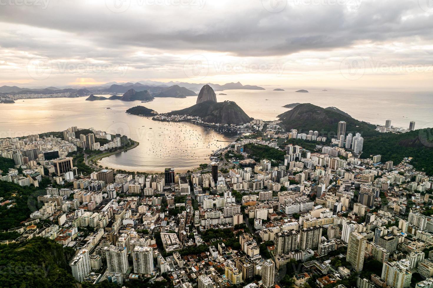 Sugarloaf mountain in Rio de Janeiro, Brazil. Botafogo buildings. Guanabara bay and Boats and ships. photo