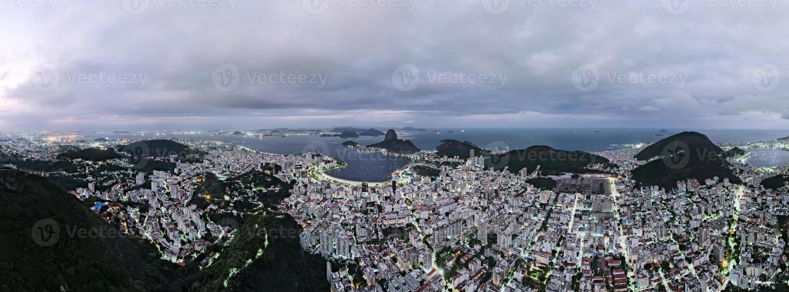 Sugarloaf mountain in Rio de Janeiro, Brazil. Botafogo buildings. Guanabara bay and Boats and ships. photo