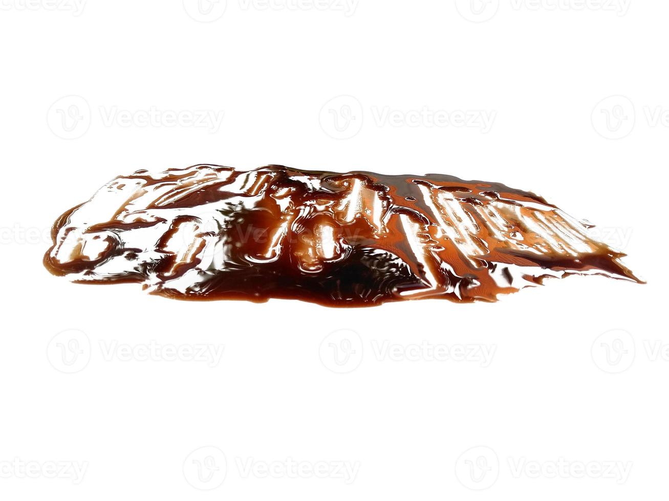 Texture of spilled soy sauce. Soy sauce on white background. Spilled soy sauce sauce puddle isolated on white background photo