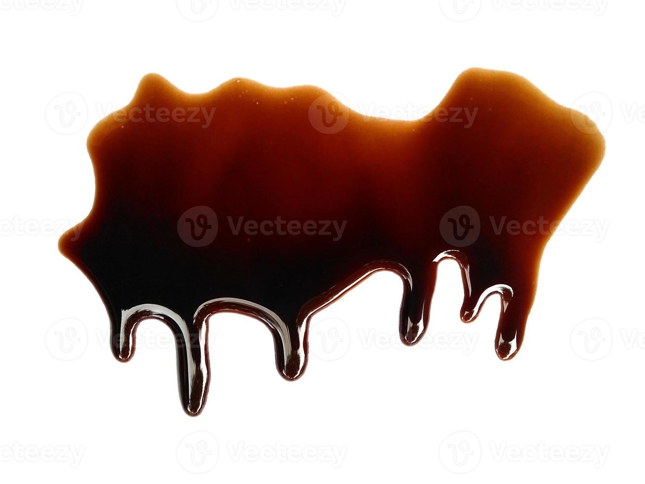 Texture of spilled soy sauce. Soy sauce on white background. Spilled soy sauce sauce puddle isolated on white background photo