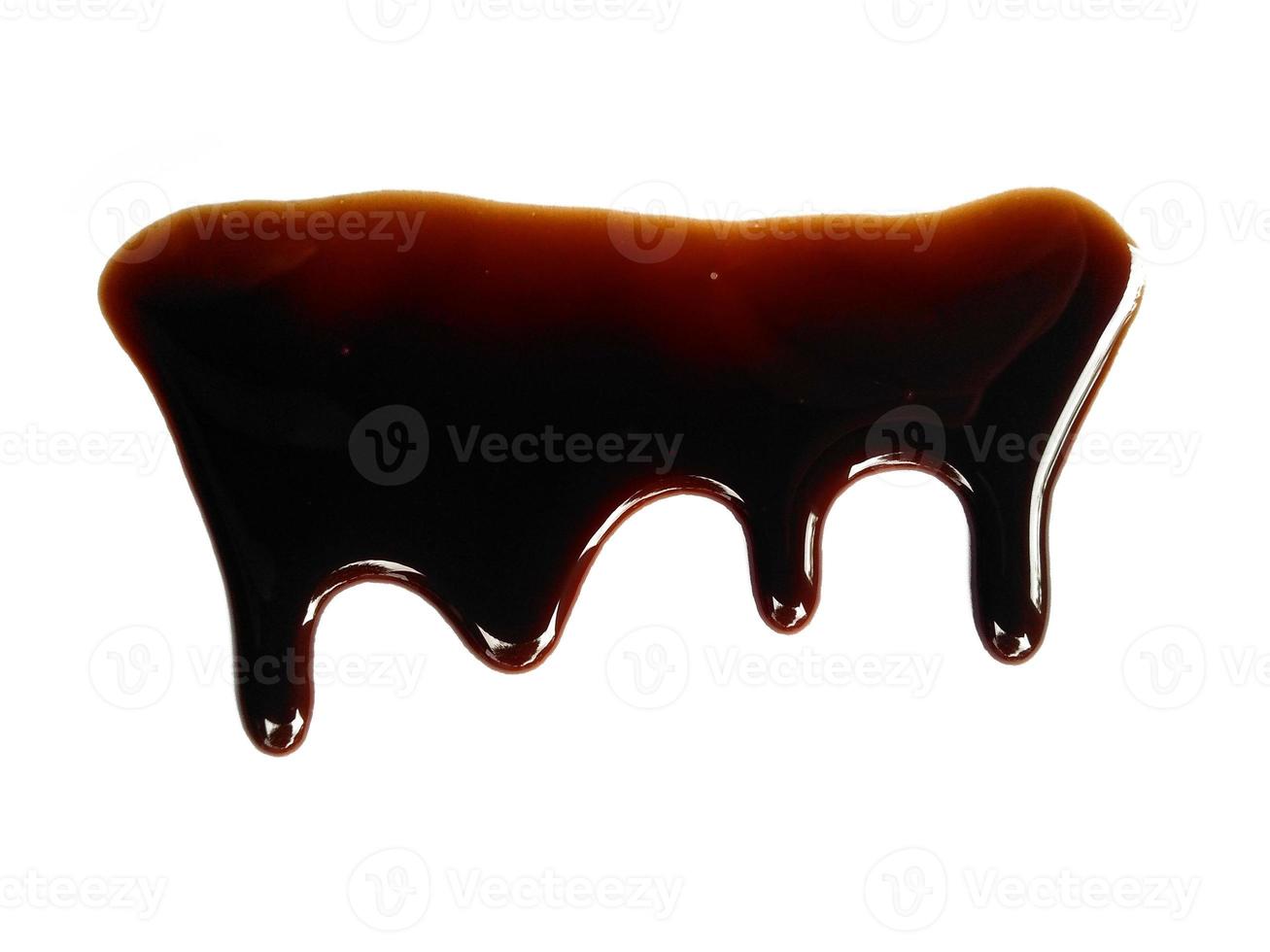 Texture of spilled soy sauce. Soy sauce on white background. Spilled soy sauce sauce puddle isolated on white background photo