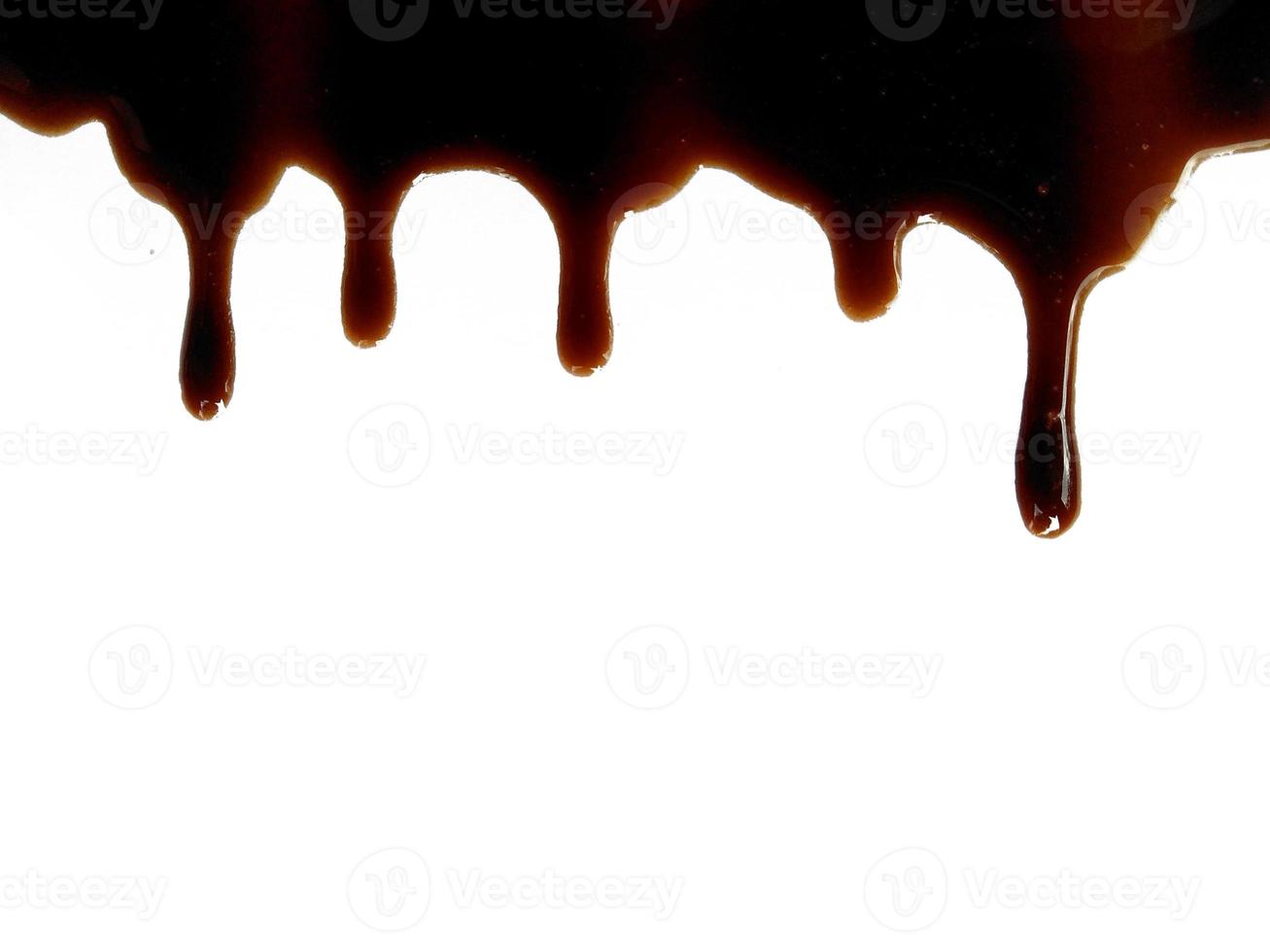 Texture of spilled soy sauce. Soy sauce on white background. Spilled soy sauce sauce puddle isolated on white background photo