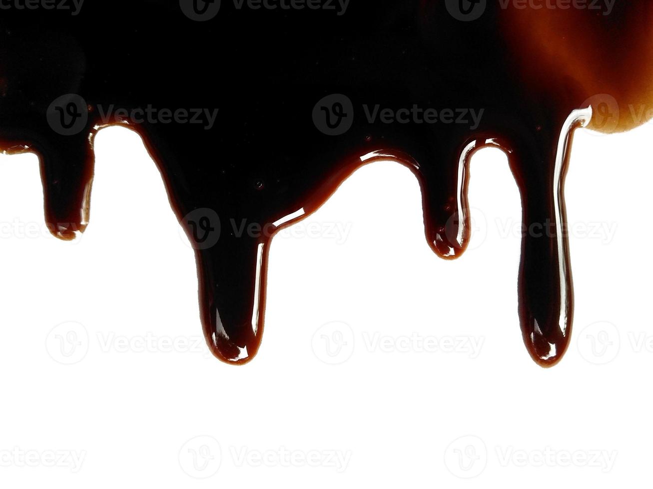 Texture of spilled soy sauce. Soy sauce on white background. Spilled soy sauce sauce puddle isolated on white background photo