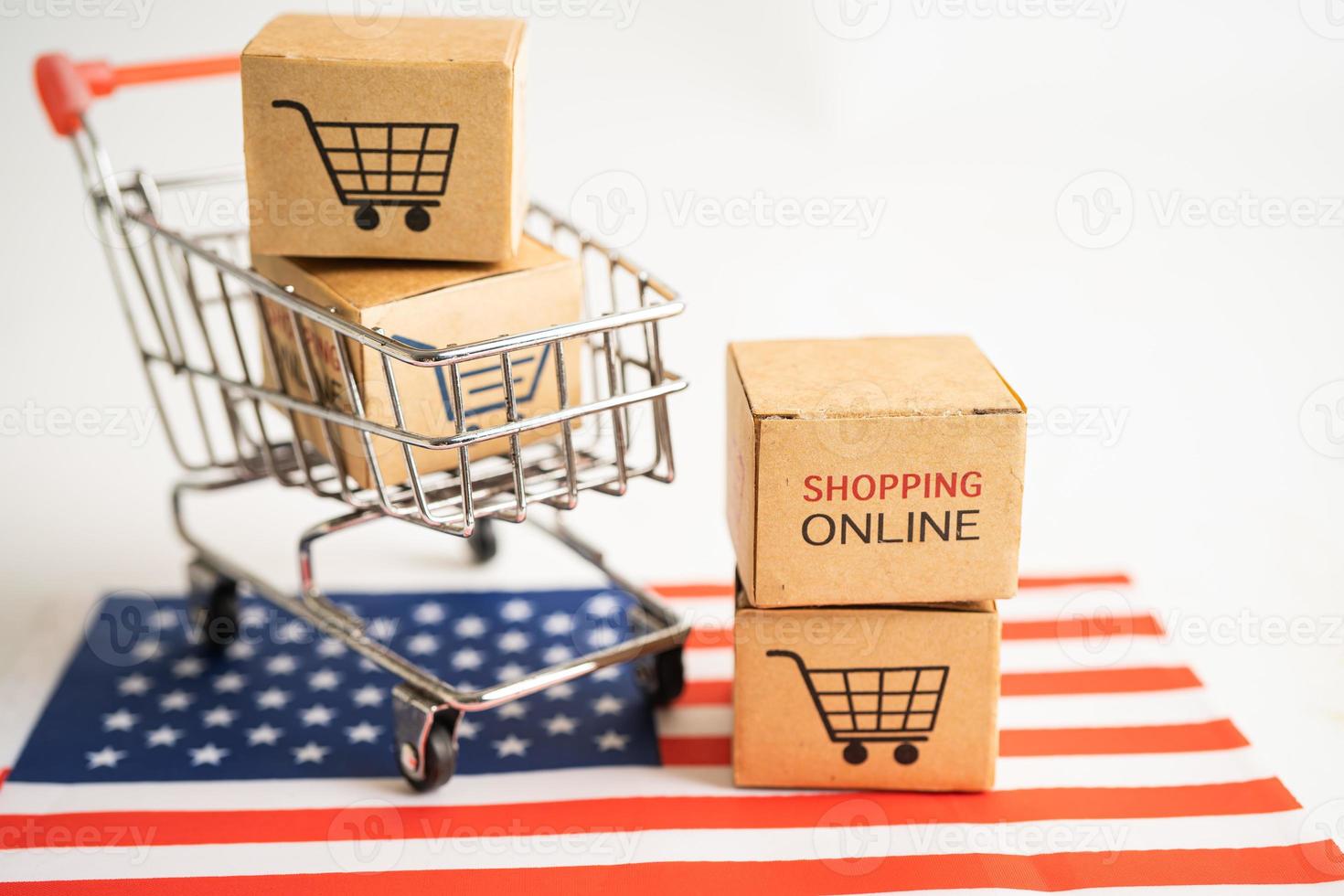 Box with shopping online cart logo and USA America flag, Import Export Shopping online or commerce finance delivery service store product shipping, trade, supplier concept. photo