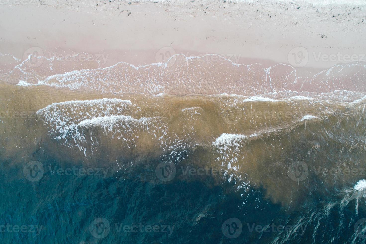Blue sea and waves and sandy beach. photo