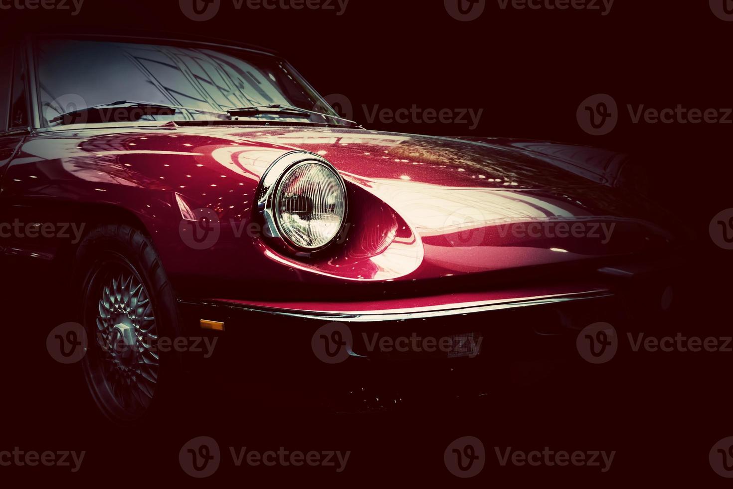 Retro classic car on dark background. Vintage, elegant photo