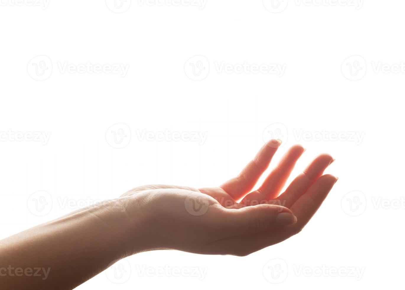 Hand in gesture of holding, giving. Strong backlight, isolated on white photo