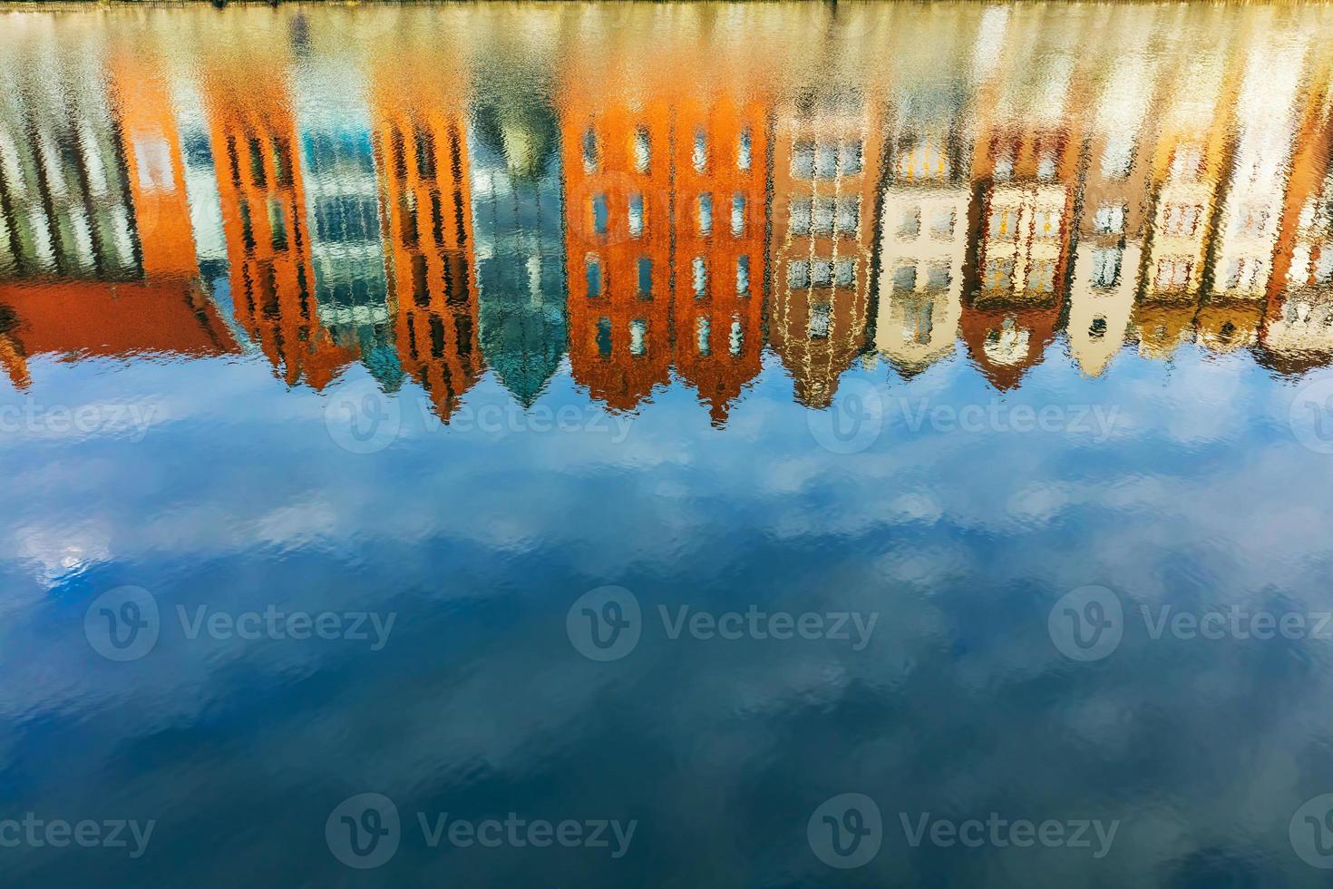 Reflection of Old Town buildings in Motlawa river. photo