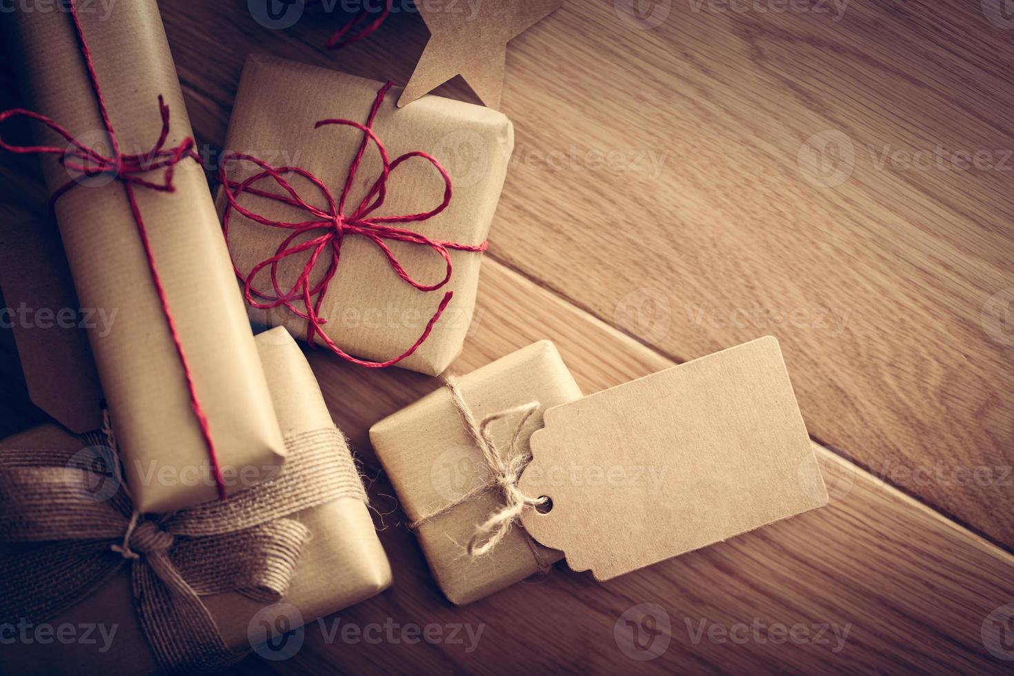 Rustic retro gift, present boxes with tag. Christmas time, eco paper wrap. photo