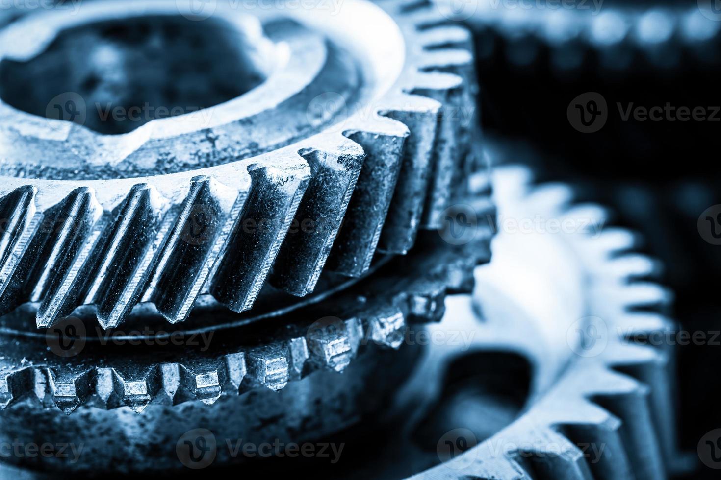 Gears, grunge cogwheels, real engine elements close-up. Heavy industry photo