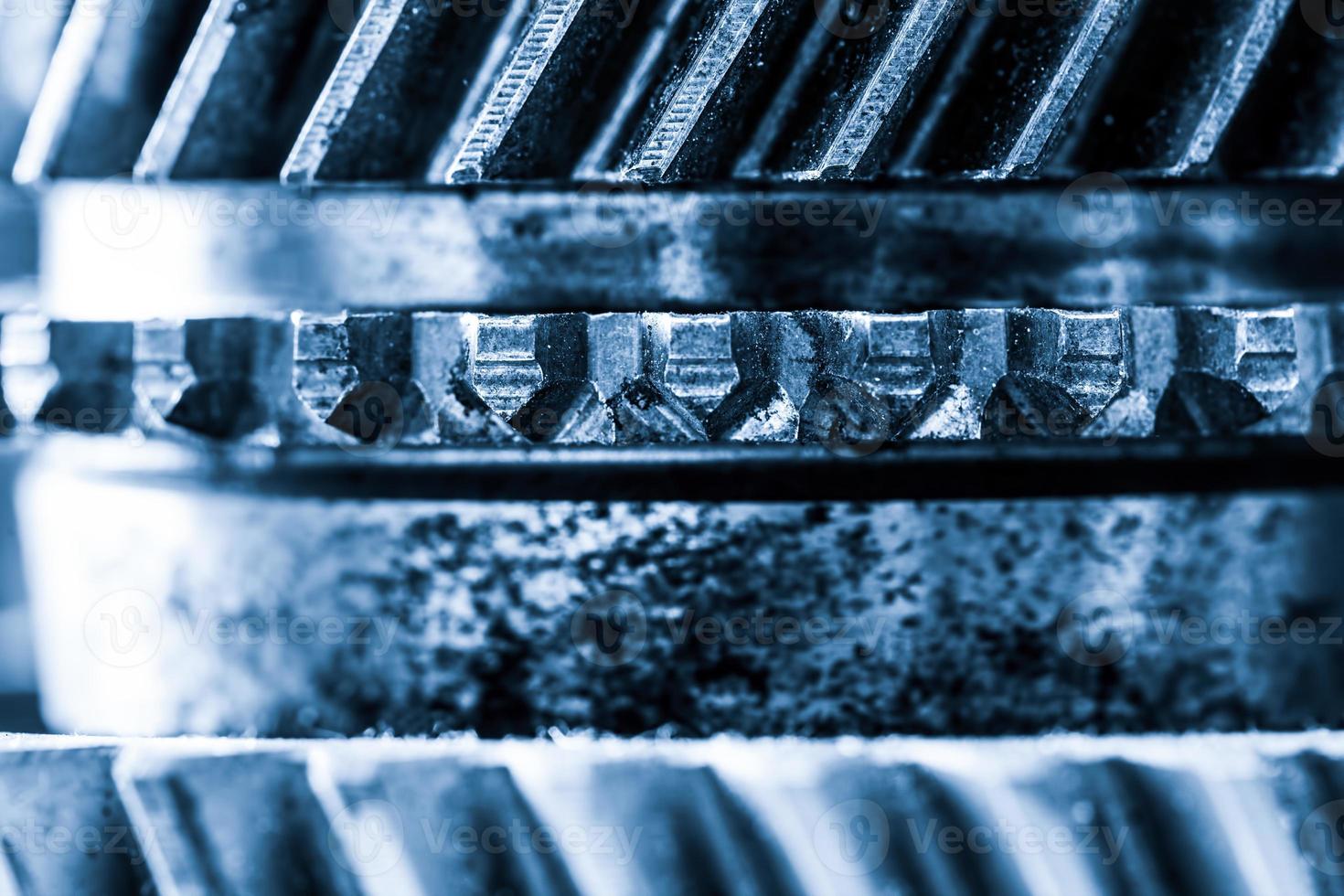 Gears, grunge cogwheels, real engine elements close-up. Heavy industry photo
