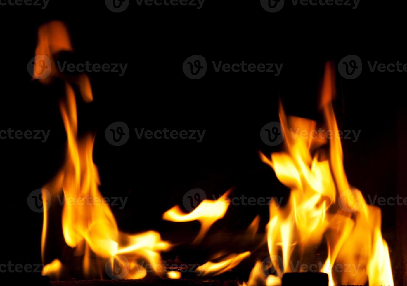 Fire flames on black background photo