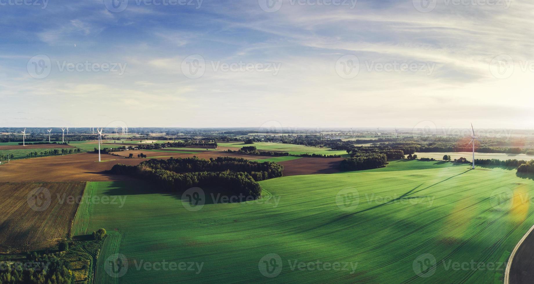 Green meadows with windmills in Poland. photo