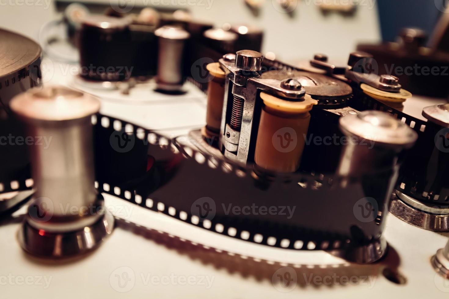 Cinematic machine with film tape and reels. photo