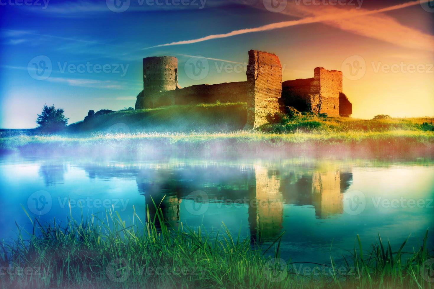 Old castle ruins at magical sunset photo