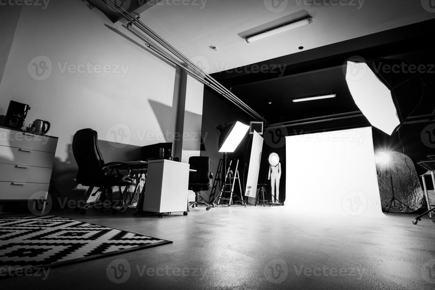 Photo studio interior with lighting equipment.