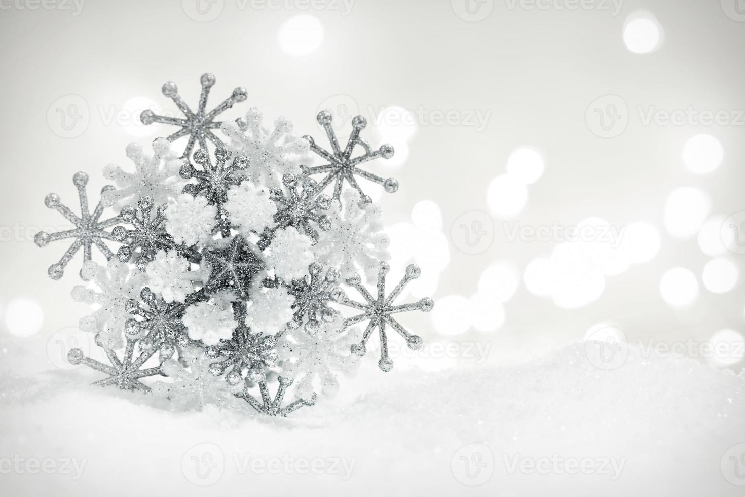 Winter snowflake decoration on glitter background. photo