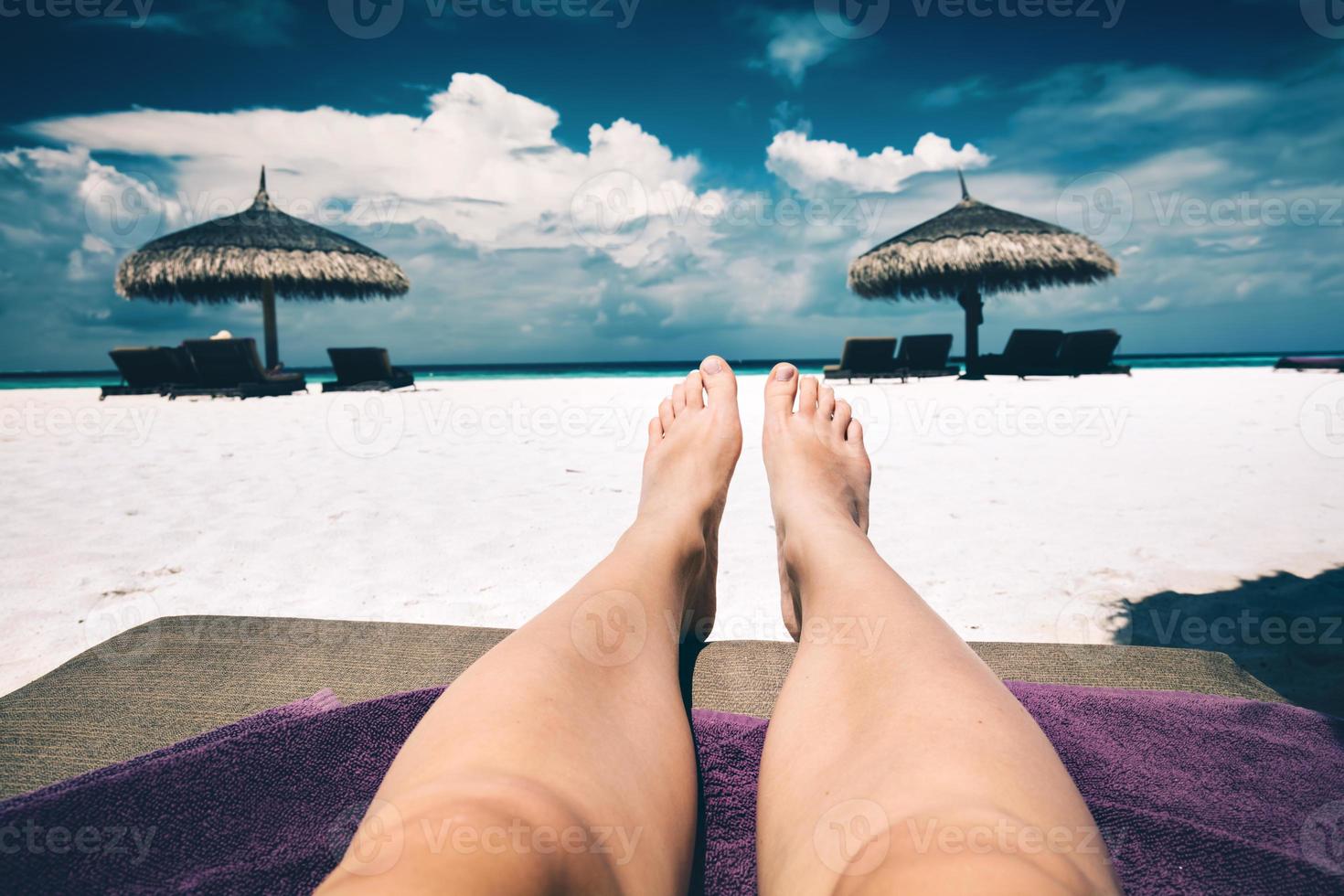 Resting on a beach. First person view. Maldives photo