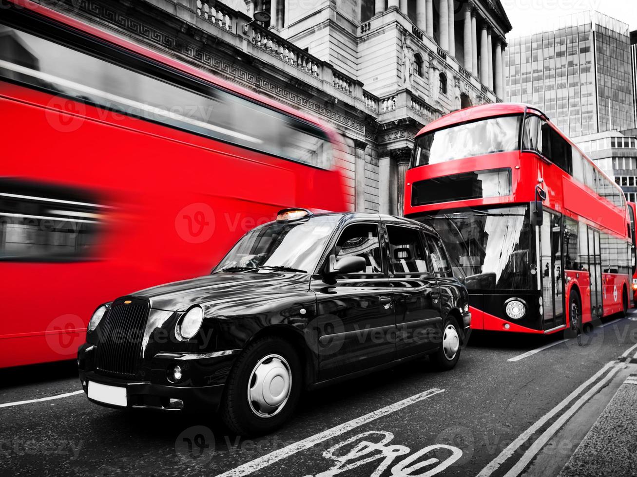 Symbols of London, the UK. Red buses, black taxi cab. Black and white photo