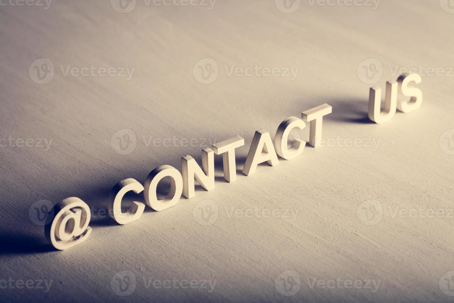 CONTACT US text made from white letters photo