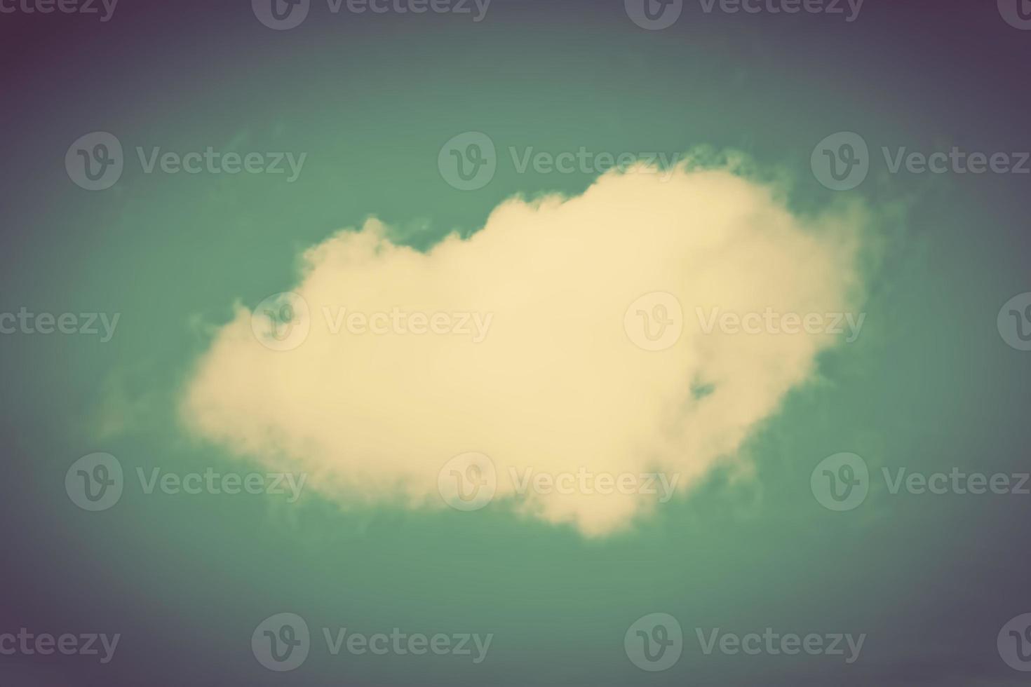 A single cloud on clear sky. Retro, vintage style photo