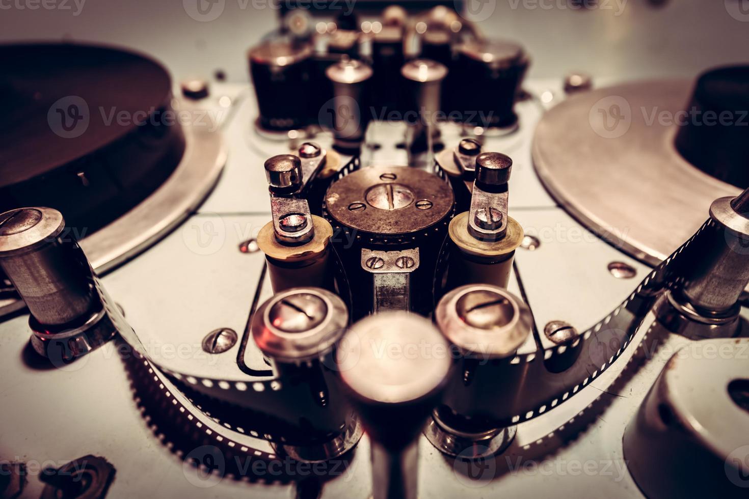 Metal parts of an old cinematographic machinery. photo