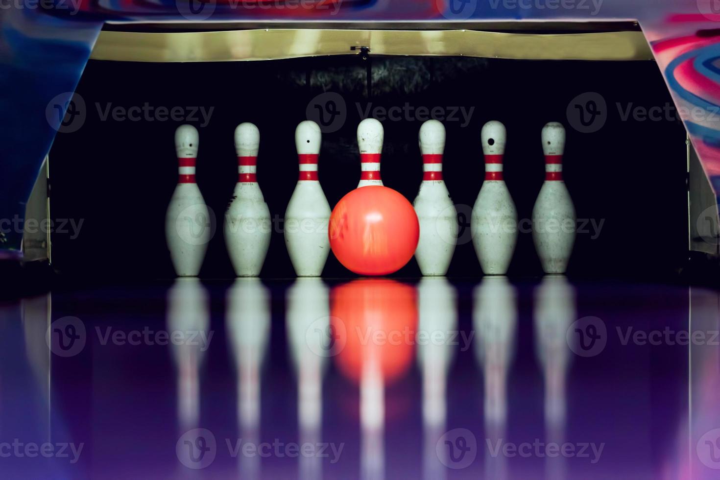 Bowling. Ball is going to hit skittles photo