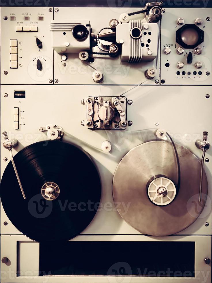 Antique recording machine with film tapes photo