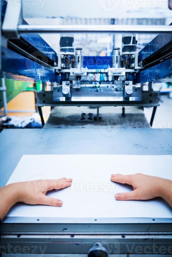 Worker setting print screening metal machine photo