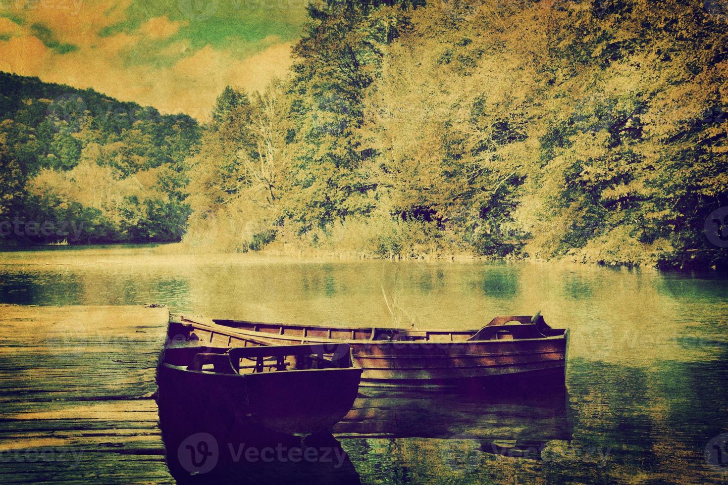 Lake and two boats in forest. Retro photo