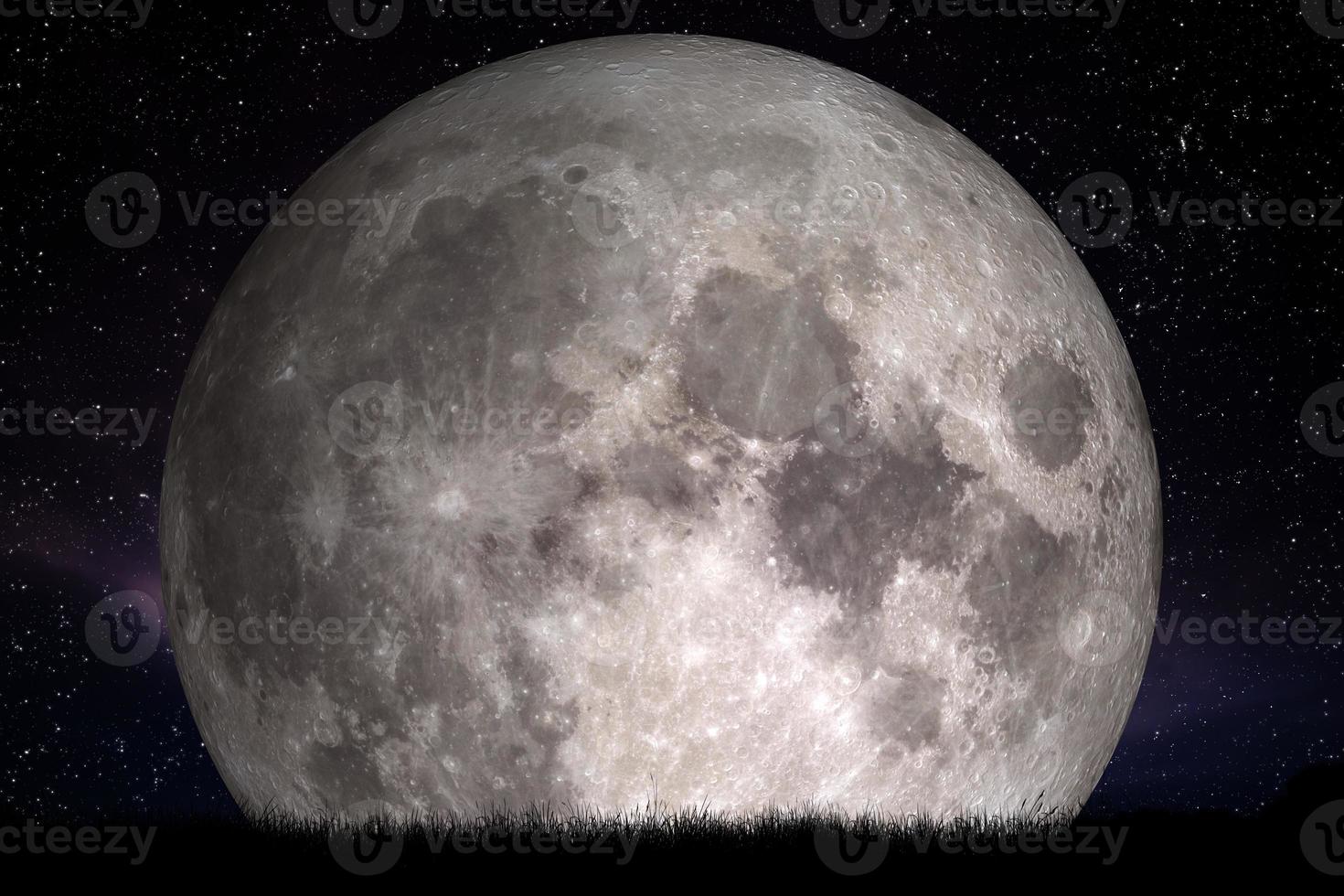 Full moon at night. Grass in the foreground. Perfect for background, copy-space photo