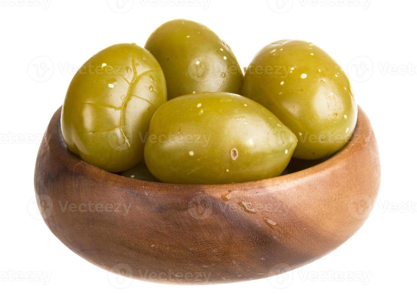 Pickled tomatoes isolated on the white background photo