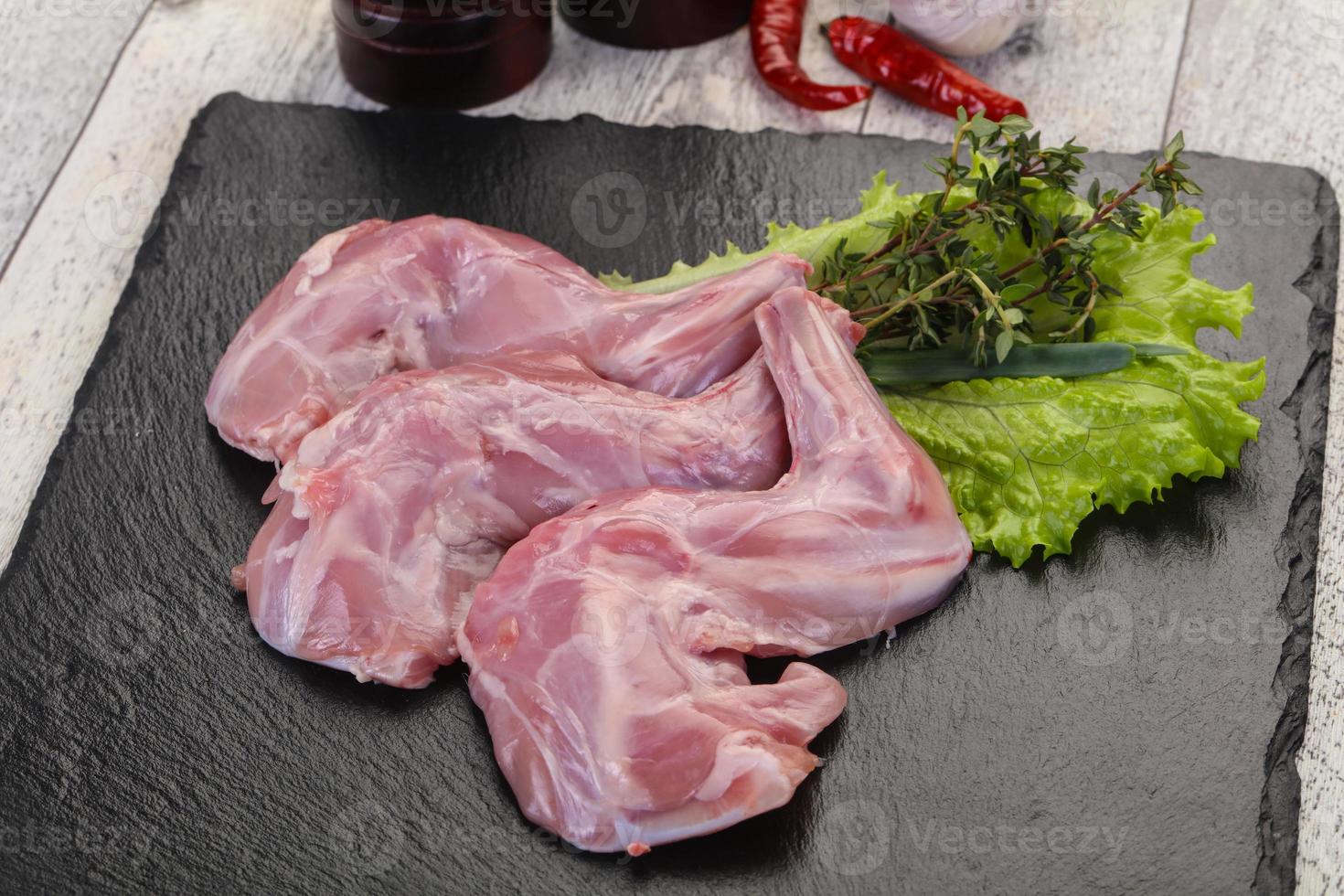 Raw rabbit legs photo