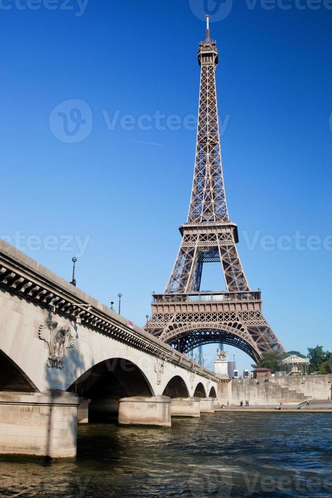 Eiffel Tower and bridge on Seine river in Paris, France. photo
