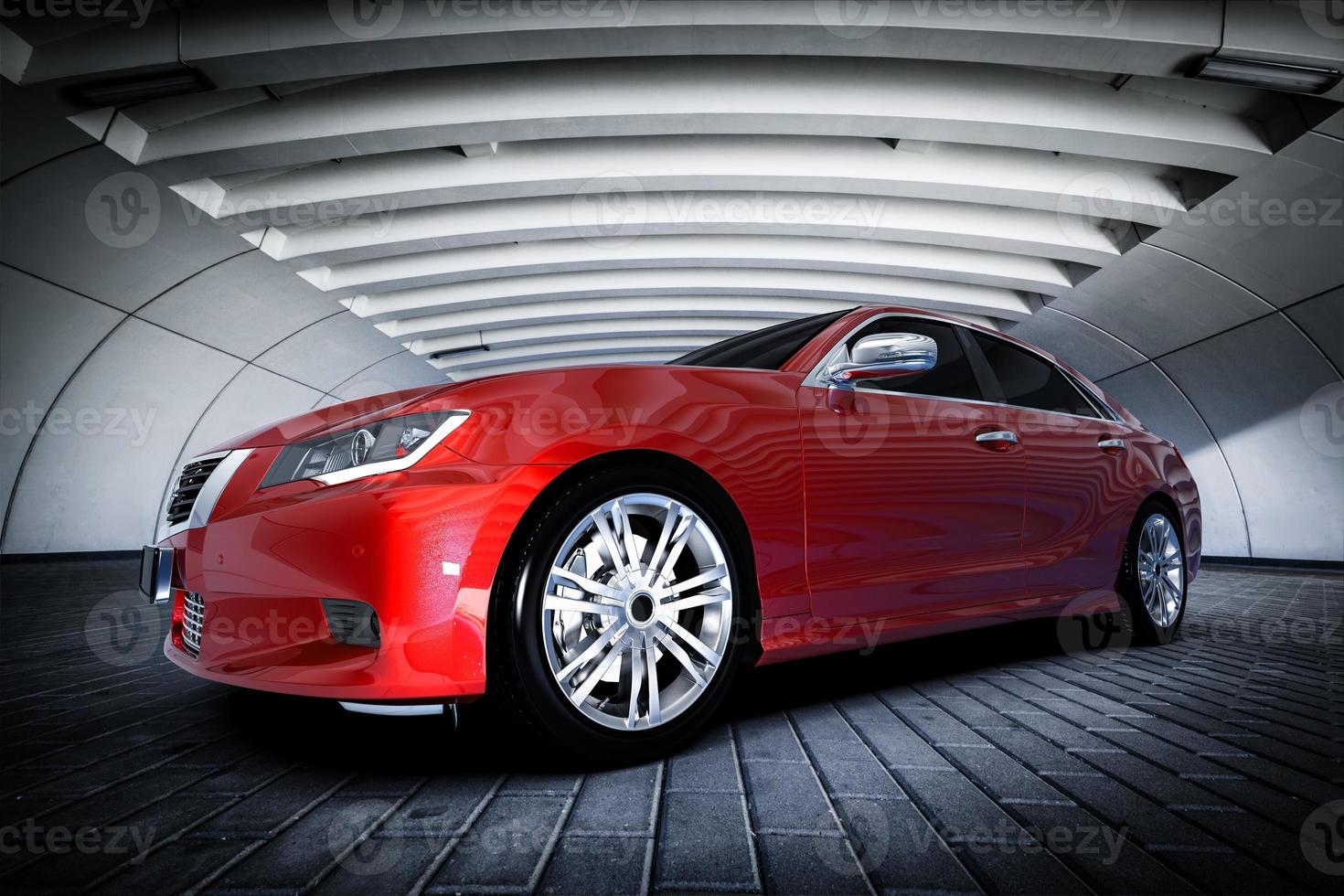 Modern red metallic sedan car in urban setting - tunnel. Generic design, brandless photo