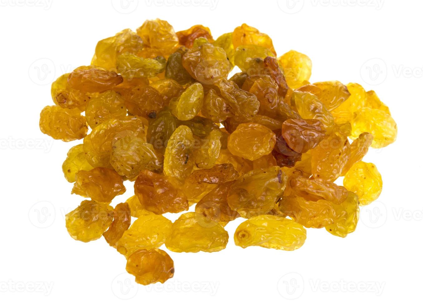 Golden raisins over white photo