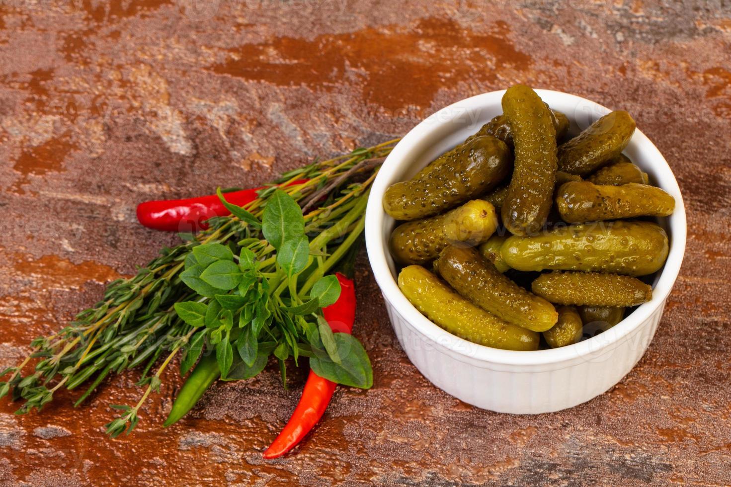Pickled small cucumbers photo