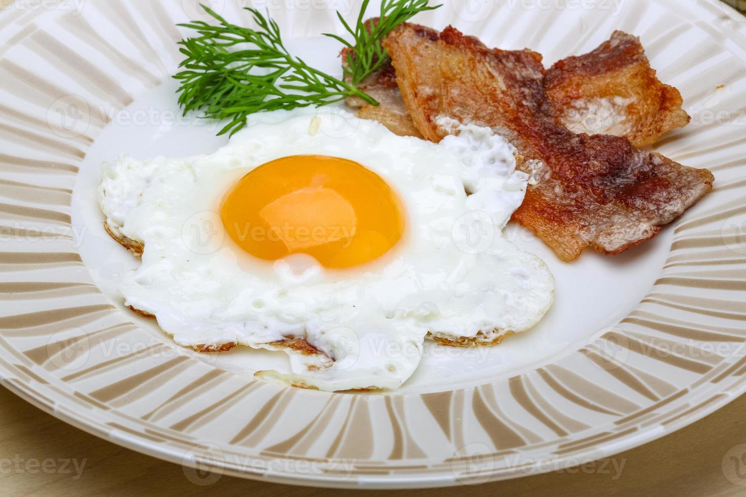 Breakfast - egg with bacon photo