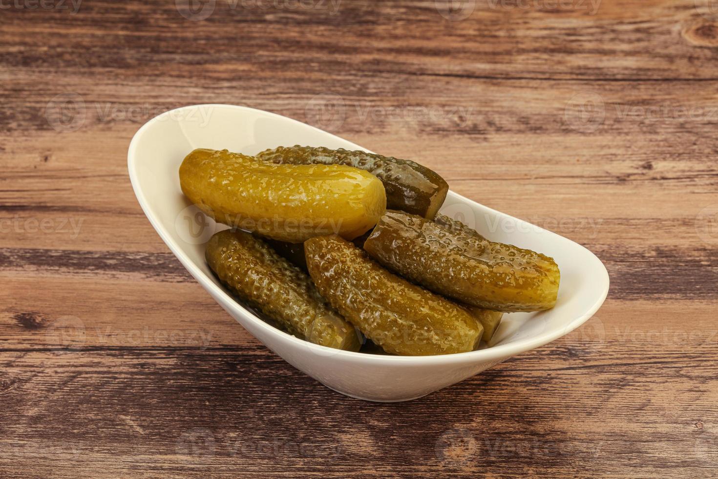 Pickled cucumbers in the plate photo