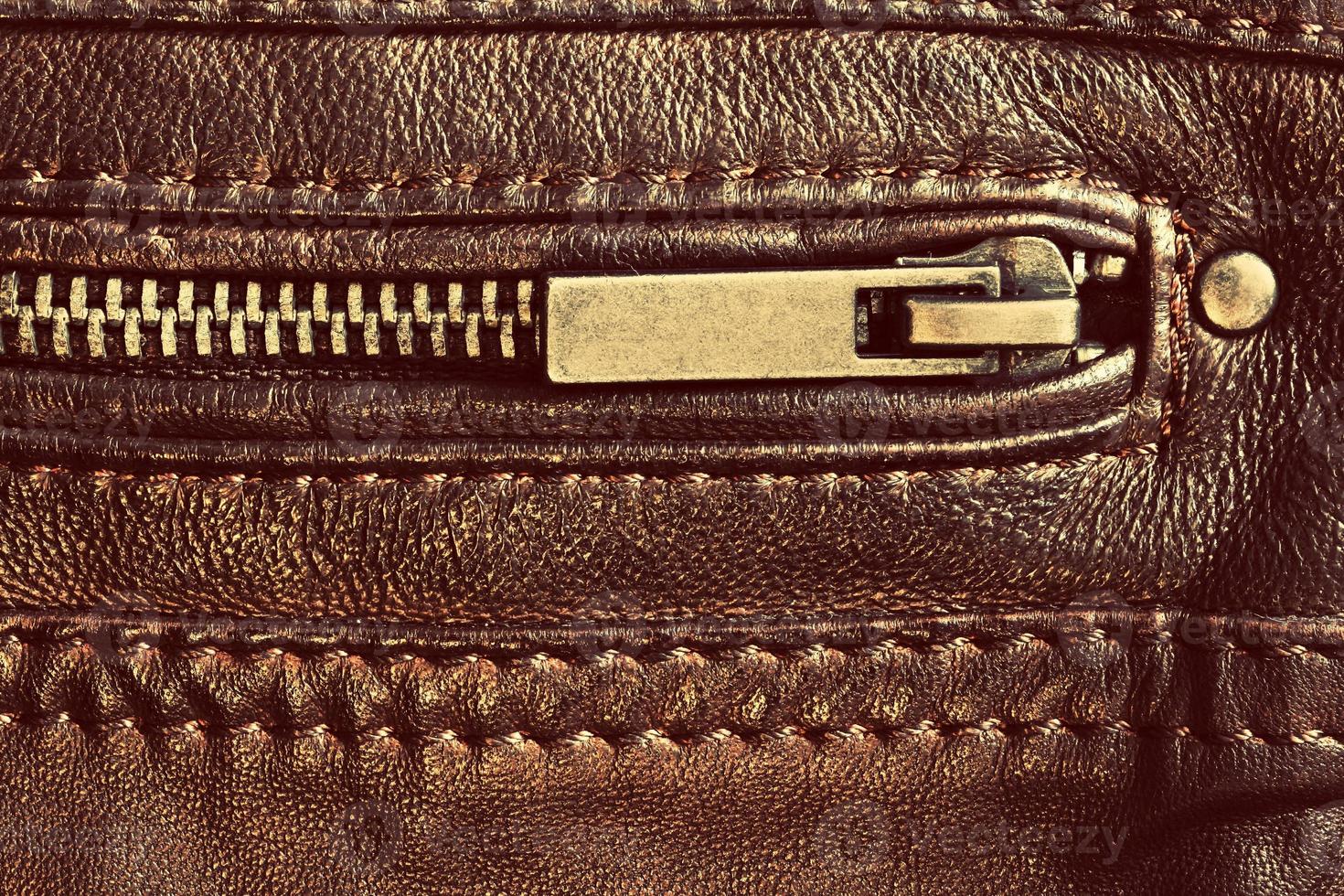 Genuine brown leather with zip and seam. Background photo